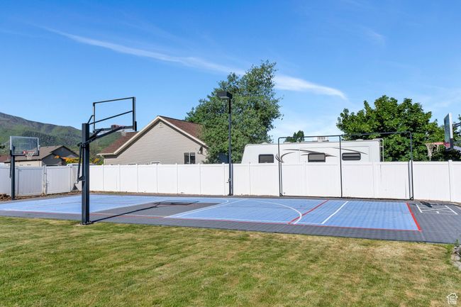 View of sport court featuring basketball court and a mountain view | Image 29