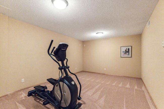 The other family area makes a great weight room. | Image 23