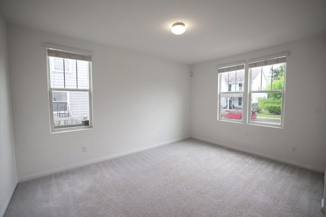 This versatile bonus room can flex as formal dining, a home office, or a cozy second living area. | Image 10