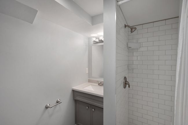 Basement bathroom tiled shower | Image 19