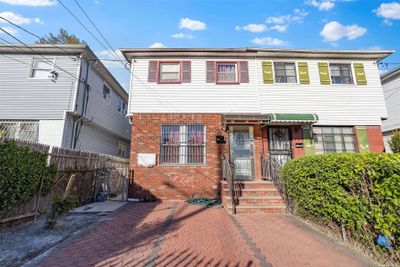 111-41 157th Street, Townhouse with 3 bedrooms, 2 bathrooms and null parking in Jamaica NY | Image 1