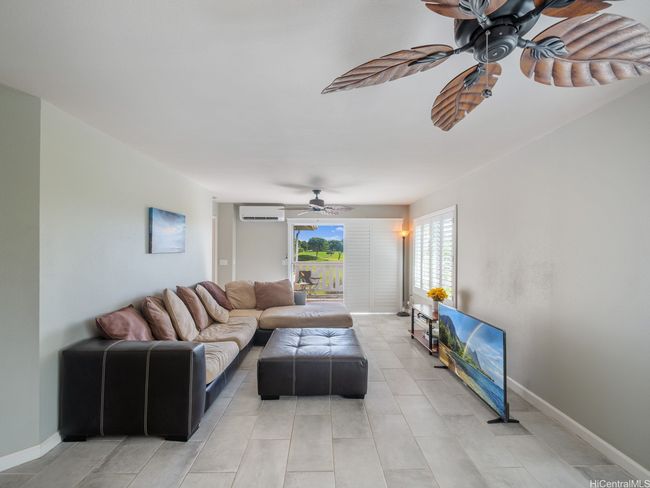 Living room with access to the lanai and golf course views | Image 8