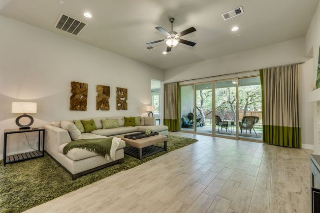 Living area with gas fireplace and sliding doors | Image 20