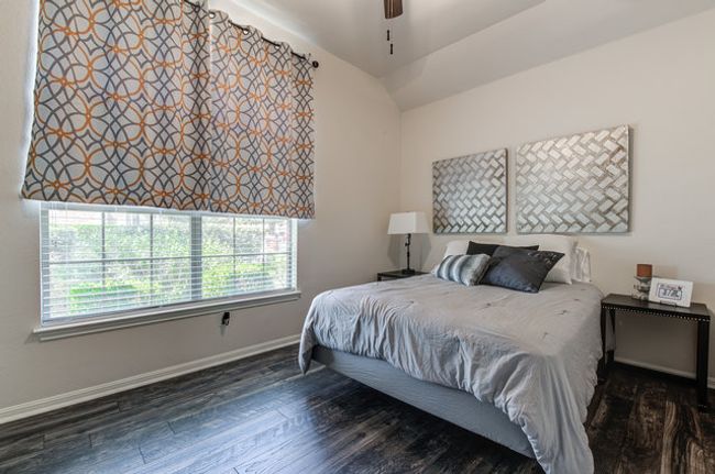Bedroom featuring baseboards, wood finished floors, and a ceiling fan | Image 15