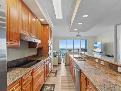 Kitchen features granite counter tops, ample cabinet space | Image 3