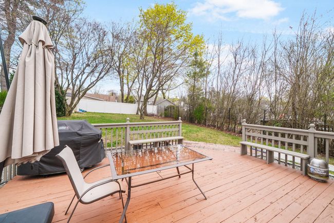 Wooden deck featuring a yard, grilling area, and fence | Image 31
