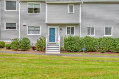 Welcome to 312 Field Point Drive! Here you will find hardwood floors on all three levels, 8 Spanish mahogany doors, beautiful light fixtures, and so much more. | Image 1