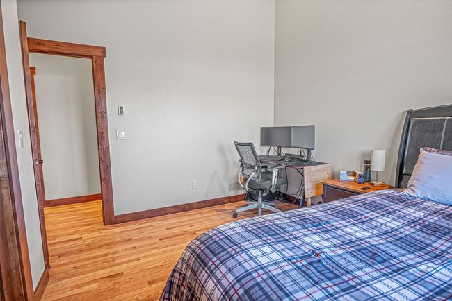 Bedroom featuring wood finished floors and baseboards | Image 30