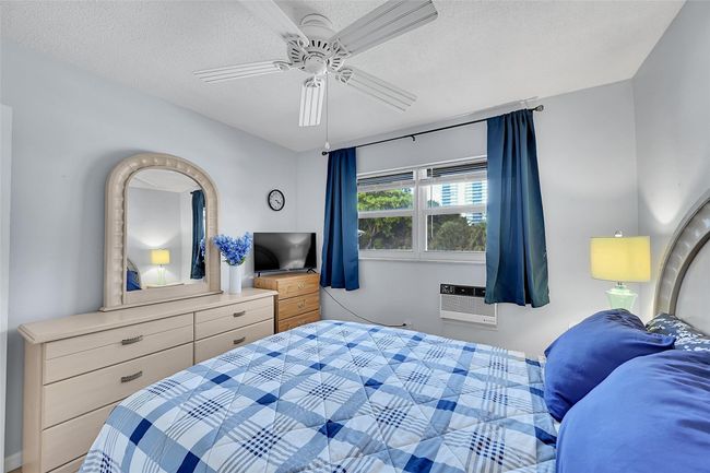 Guests will Wake up to Amazing Sunrises! Includes Impact Windows & Blinds, So Quiet! Your Furnished Guest Bedroom Includes This Queen Sized Bedroom Furniture. | Image 50