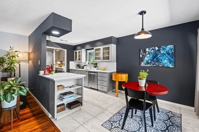 Notice tucked away storage for books or kitchen-related items | Image 27
