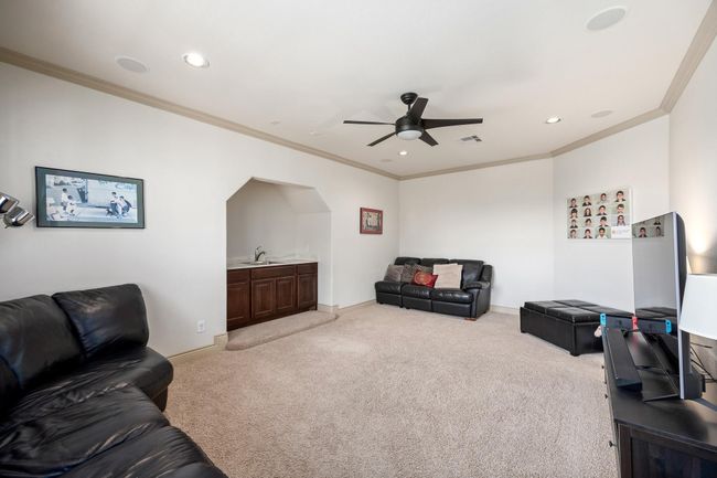 The spacious game room is tucked away upstairs to minimize noise transfer to the main living room. | Image 30