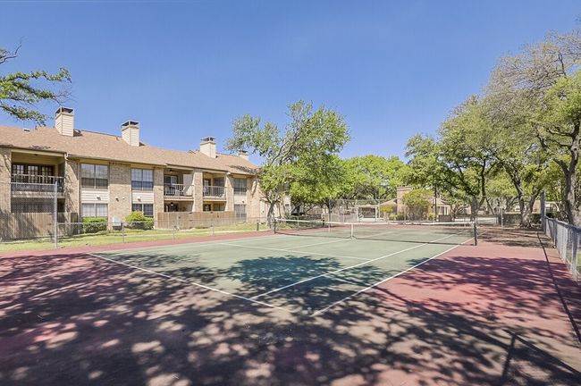 View of tennis court featuring fence | Image 23