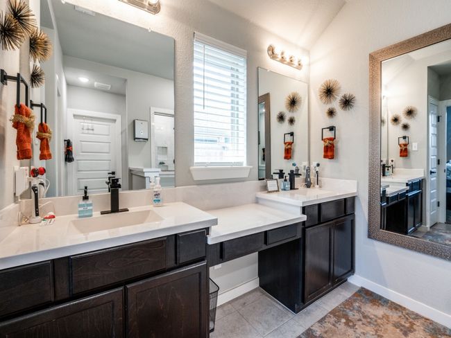 Full bathroom featuring tile patterned floors, baseboards, vanity, and a wealth of natural light | Image 23