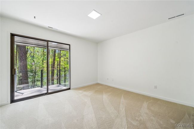 Spare room featuring light carpet, visible vents, and baseboards | Image 37