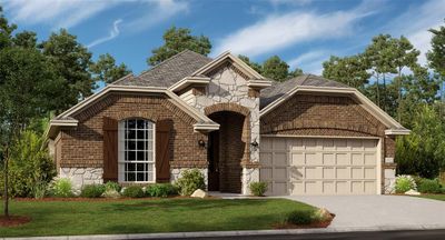 View of front of property featuring a front yard and a garage | Image 1