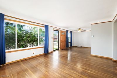 Spare room featuring hardwood / wood-style floors and ceiling fan | Image 3