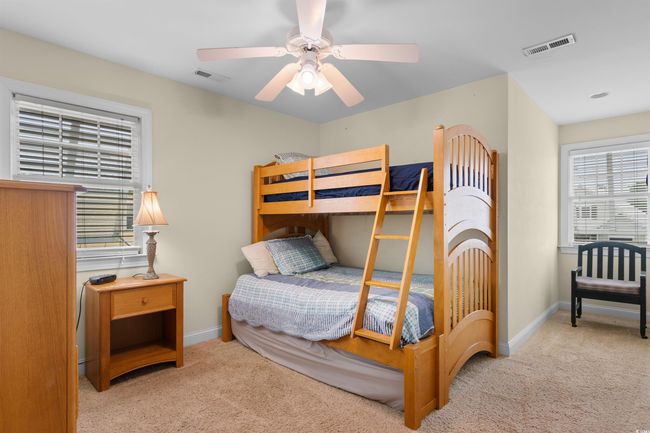 Carpeted bedroom with baseboards and a ceiling fan | Image 24