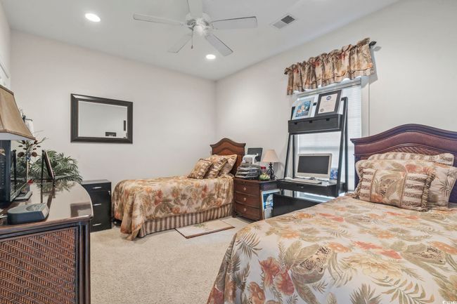 Bedroom featuring carpet floors, recessed lighting, and a ceiling fan | Image 5