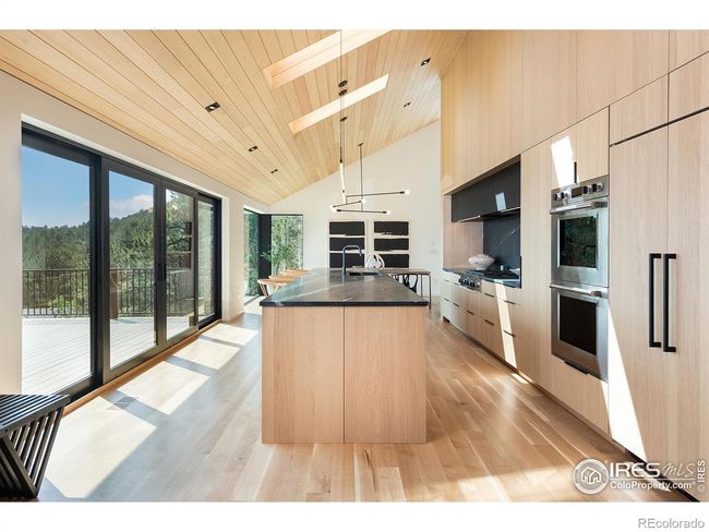 Rift-sawn white oak cabinetry, soaring centerpiece wall, natural Soapstone countertops | Image 9