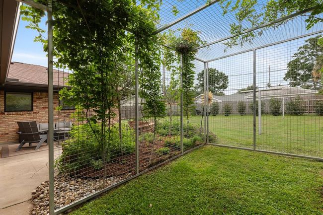 The back yard also features a custom dog run. | Image 18