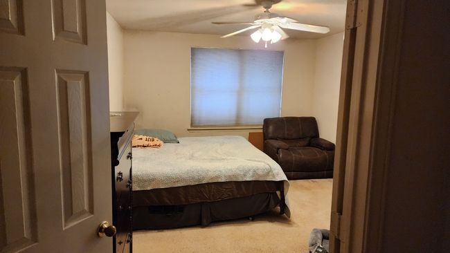 Bedroom with carpet and a ceiling fan | Image 14