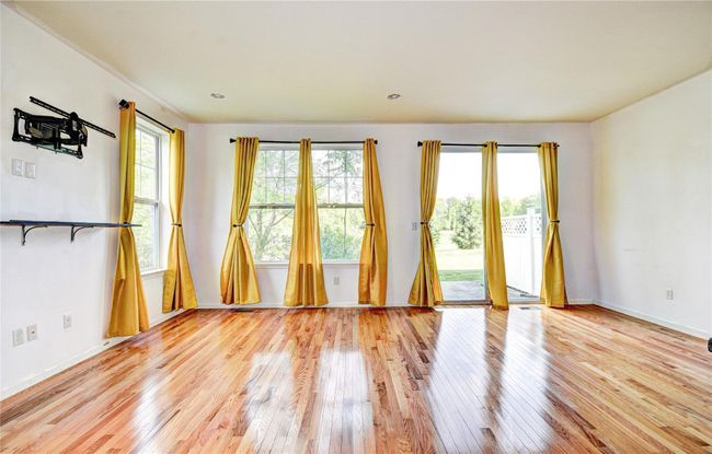 Empty room featuring hardwood flooring | Image 5