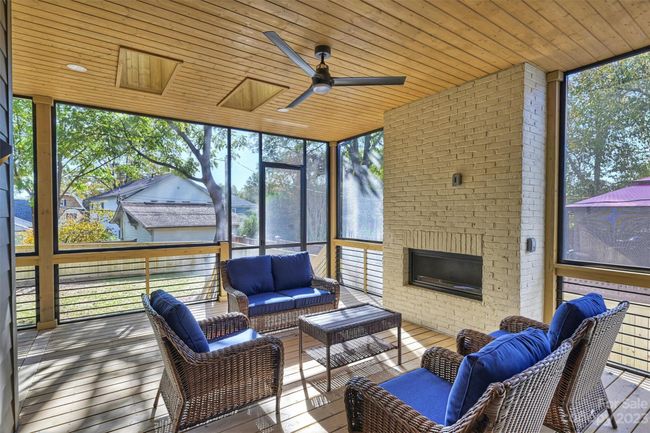 Covered screened porch with fireplace | Image 30