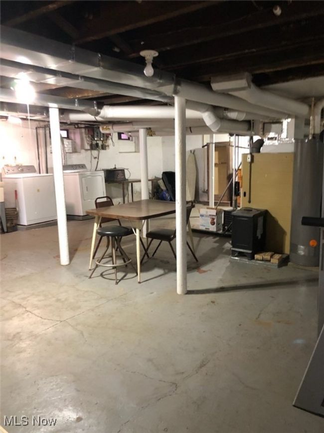 Basement featuring washing machine and clothes dryer | Image 31