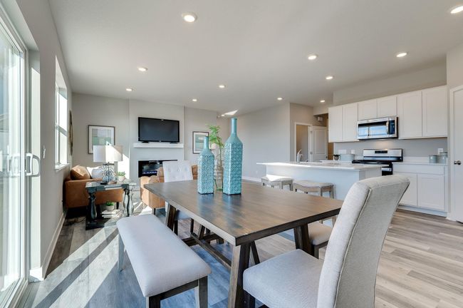 Open floor plan for the living areas. Photo is of a previously built model home, finishes and selections will vary. | Image 10