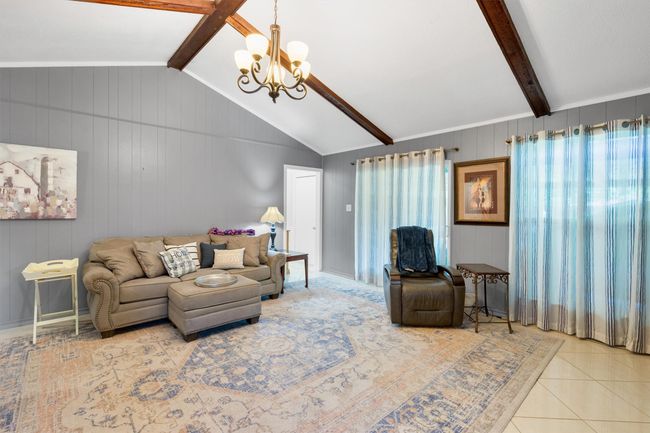 Door leads to half bath and access to the garage. | Image 4
