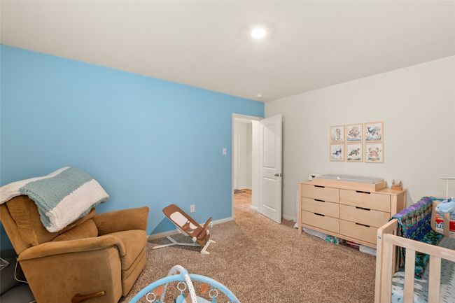 Bedroom with light carpet and recessed lighting | Image 26