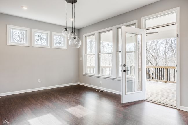 Walk out onto your deck overlooking the wooded nature preserve. | Image 25