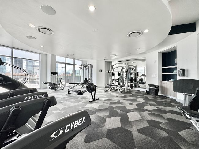 Exercise room with recessed lighting, carpet floors, and healthy amount of natural light | Image 33