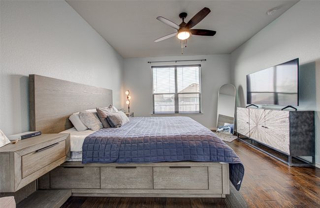 Bedroom with dark wood-type flooring | Image 13