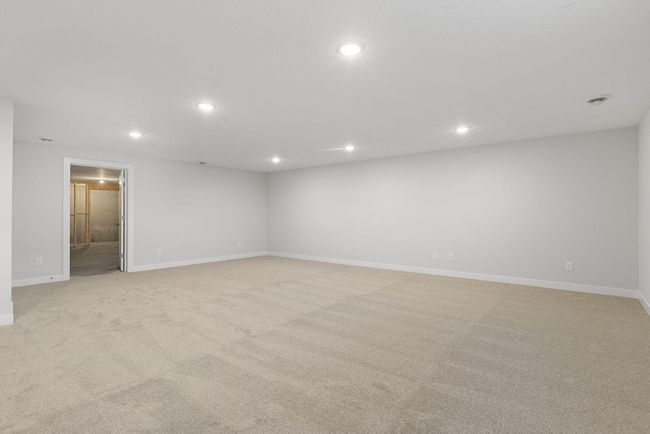This expansive FINISHED basement is an ideal space for hosting gatherings, with plenty of room for a cozy living room. | Image 34