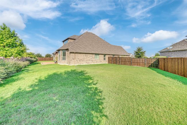 View of fenced backyard | Image 39