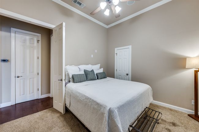 Bedroom featuring ornamental molding, baseboards, carpet, and a ceiling fan | Image 24