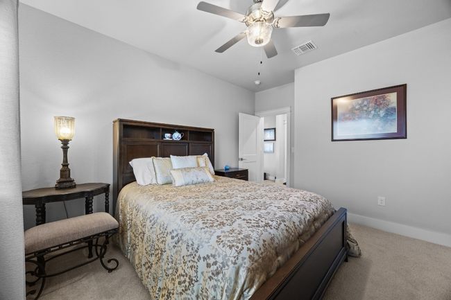 This expansive upstairs bedroom is filled with abundant natural light and offers ample space to comfortably fit a king-size bed. | Image 35