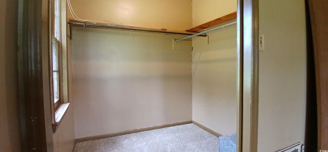 Walk in closet featuring carpet flooring | Image 24