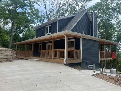 Country-style home featuring a porch | Image 3