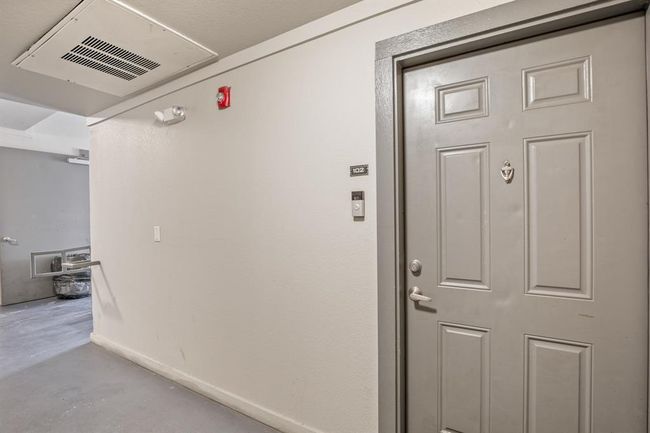 Corridor with concrete floors and baseboards | Image 19
