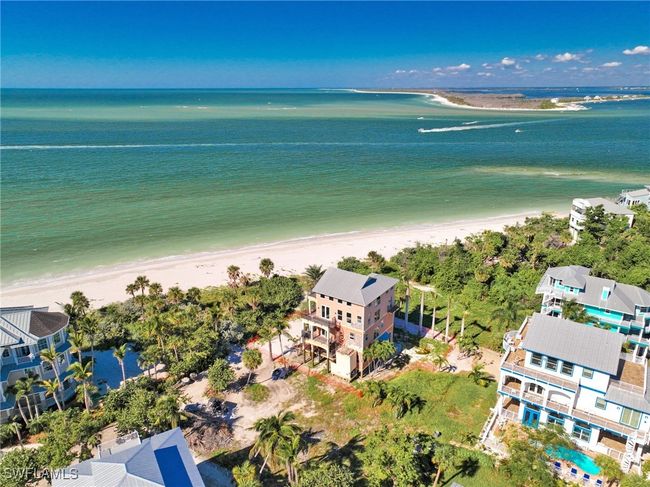 Birds eye view of property featuring a water view and a view of the beach | Image 14