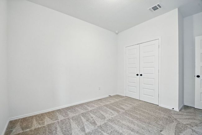 Unfurnished bedroom featuring carpet floors and a closet | Image 22