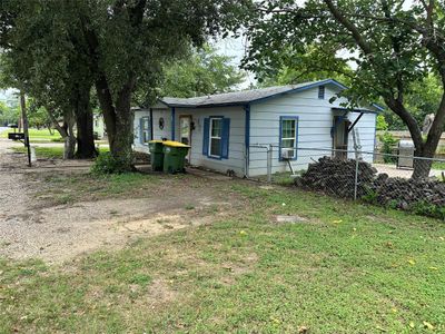 Rear view of property featuring a yard | Image 3