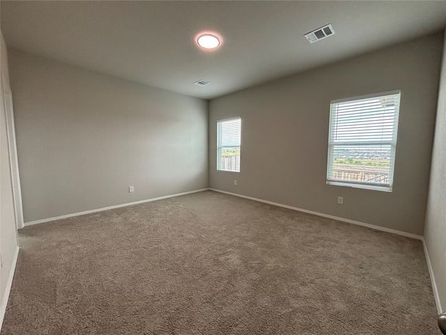 Carpeted empty room featuring baseboards | Image 22
