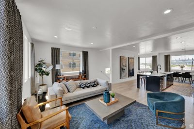 Living room featuring light hardwood / wood-style flooring and sink | Image 1