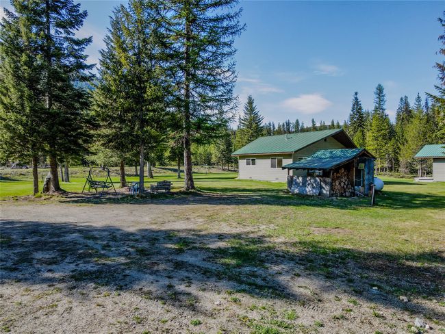 View of green lawn featuring an outdoor structure | Image 69
