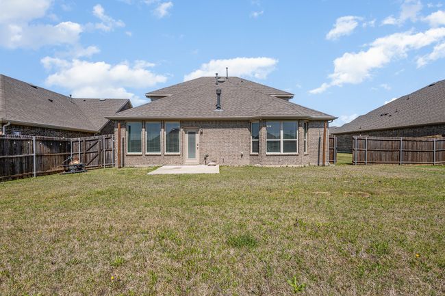 Back of house featuring a patio area, brick siding, a fenced backyard, and a lawn | Image 27