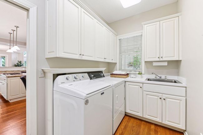 Main floor laundry - Single-level living perfected. | Image 15