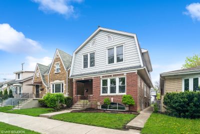 3945 N Olcott Avenue, Home with 5 bedrooms, 2 bathrooms and 2 parking in Chicago IL | Image 1